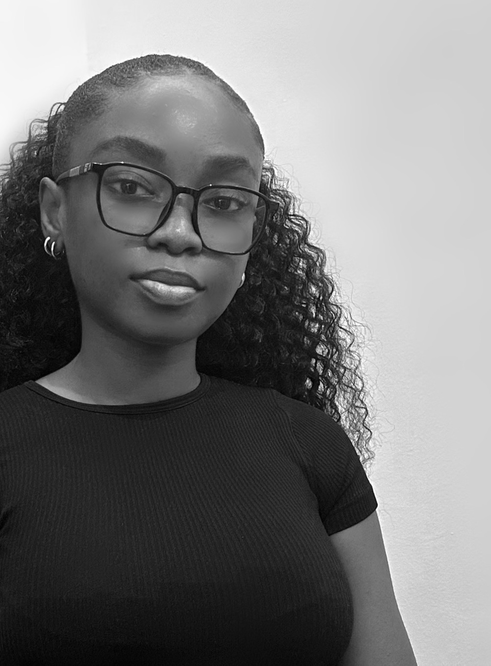 Black-and-white portrait of Ghanaian visual artist El-ham Tabsoba